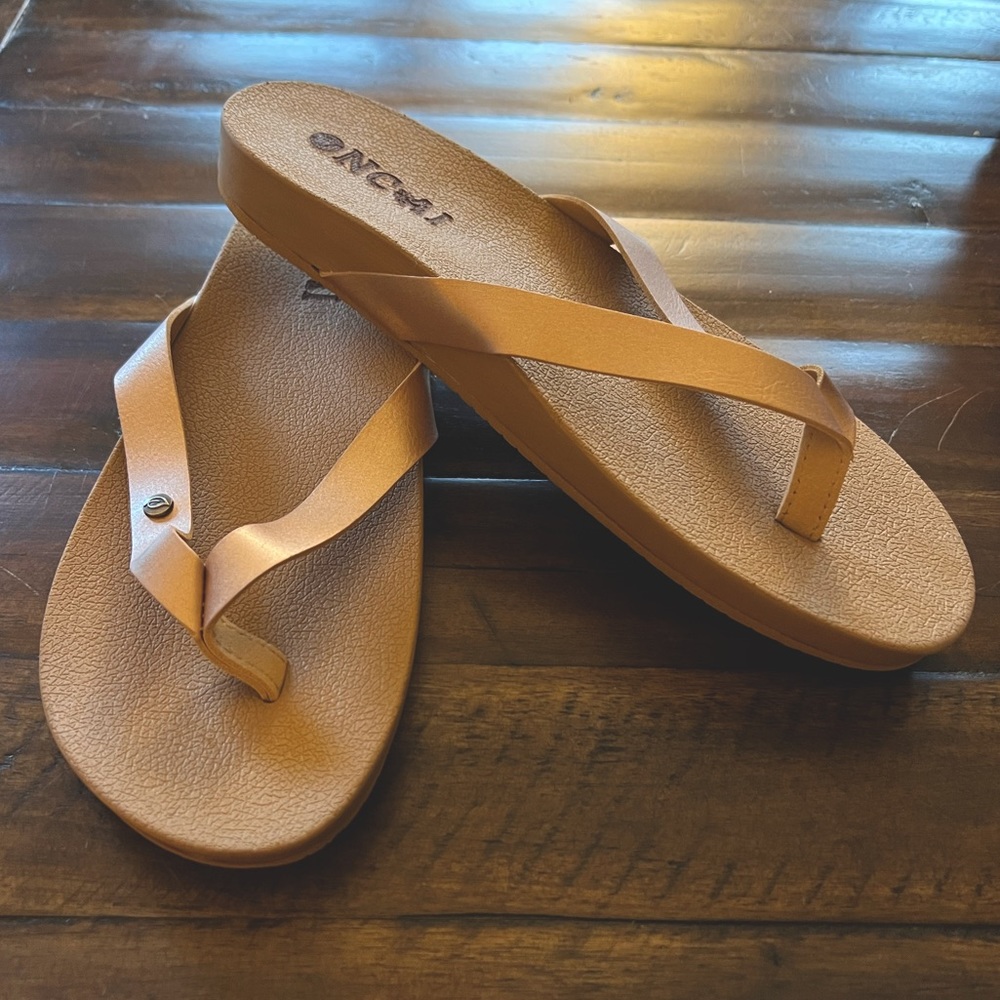 Flip flops with rose gold leather straps